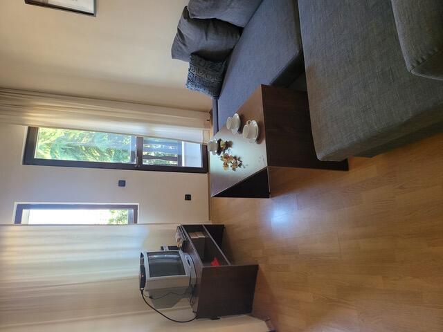 A living room with a couch and coffee table.